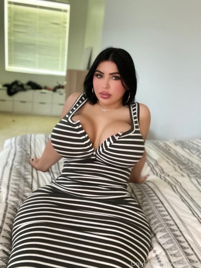 Beautiful PAWG in Striped Dress Sitting on Bed 